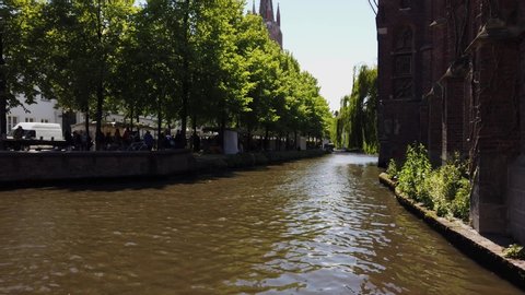 Calm canal in Brugge on a summer day.