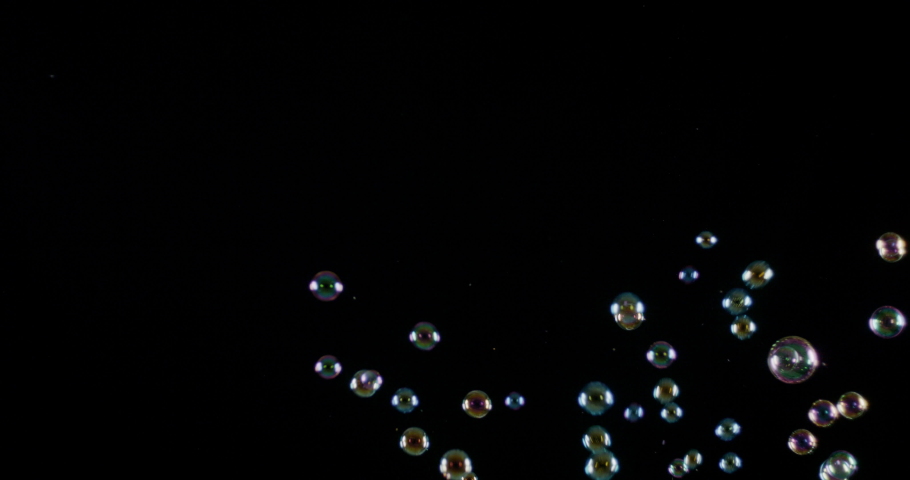 Large and clear water bubbles floats over a black background | Shutterstock HD Video #1034846327