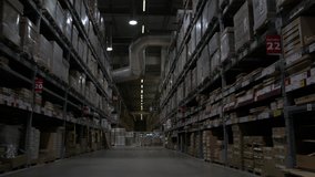 Cargo Cardboard Boxes In Logistic Storage Warehouse Dolly Shot. Walking through a huge warehouse corridor with shelves full of boxes, slow motion - Powered by Shutterstock - Get 15% off with code: PIKWIZARD15