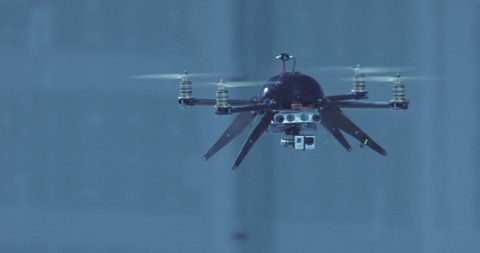 Futuristic sci-fi drone approaches inside industrial building