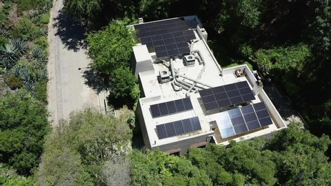 Solar Photovoltaic Panels on Rooftop on Modern Residental House in Bel Air, California. Alternative Environmental Enegry Concept