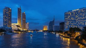 Time lapse of Boat moving in Chao Phraya river and Bangkok cityscape at night.