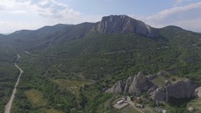 Aerial video of Crimean mountains in area of the village Sun Valley, Crimean peninsula, sunny summer day.