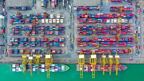 Container ship loading and unloading in port, Aerial view container shipyard business commerce trade logistic import and export cargo freight ship, transportation by container cargo ship, Timelapse 4k
