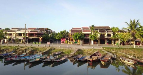 Hoi An, Vietnam : Aerial drone,cinematic golden hour footage of Hoi An ancient town, UNESCO world heritage, Quang Nam province.Vietnam.South East Asia Travel.fly across to the Hoi An river with boats 