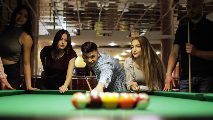 Many friends joyfully play billiards. | Shutterstock HD Video #1034902268