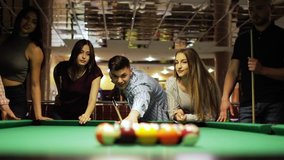 Many friends joyfully play billiards. - Powered by Shutterstock - Get 15% off with code: PIKWIZARD15