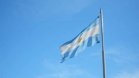 Argentina Flag Waving on a Sunny Day against Blue Sky