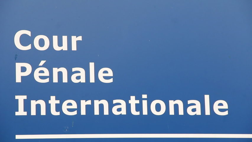 Text on sign of International Criminal Court in The Hague. The ICC is located in The Hague, the Netherlands and works with the UN Security Council to prosecute suspects of grave crimes.