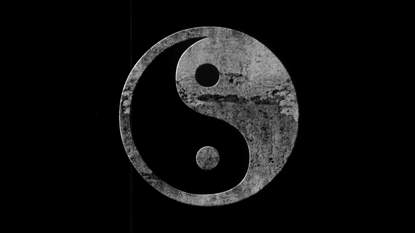 yin and yang symbol in stone