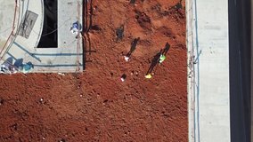 Construction Workers on top of building with crane Aerial
Drone footage over Construction Site with crane in the city top down view
