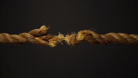 A frayed rope on the verge of snapping under stress