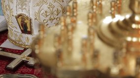 orthodox priest's headdress, cross on table near bible - Powered by Shutterstock - Get 15% off with code: PIKWIZARD15