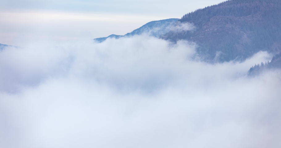 Clearing fog reveals the Vista House at Crown Point in the Columbia River Gorge, Oregon.