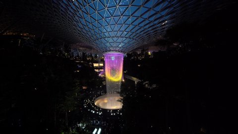 Singapore - August 10, 2019: The HSBC Rain Vortex light show with dazzling lights and laser at Jewel Changi Airport