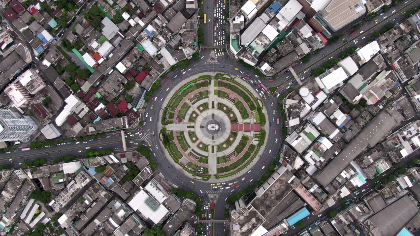 Bangkok, Thailand, top-down aerial view of traffic around huge roundabout during rush hour. Royalty-Free Stock Footage #1034941490
