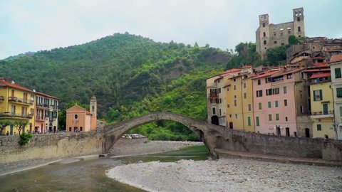 Panoramic shot of the military castle Fort Terra Dolceacqua, the old part of Dolceacqua, a city in the province of Imperia in the region of Liguria in northern Italy. Bridge over a mountain river