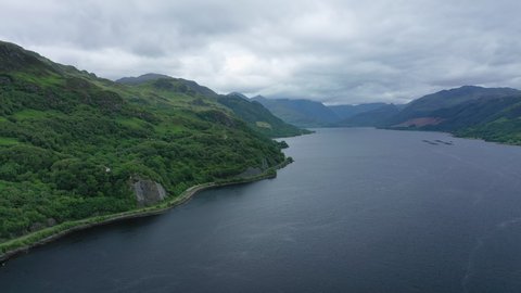 Aerial view of picturesque landscape of Highlands of Scotland around Eilean Donan Castle, lush green hills and sea Loch Duich - panorama of Scotland from above, United Kingdom, Great Britain, Europe