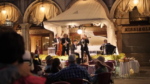 VENICE, ITALY - 25 MAY 2018: Orchestra in the restaurant on San Marco square. Nighttime.