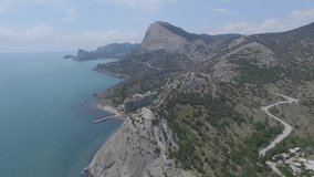 Aerial 4k video of of the Genoese fortress in resort town Sudak on the sea coast, Crimea. View of castle wall and towers.
