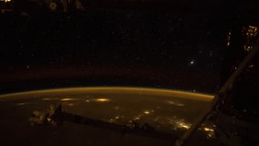 Planet Earth seen from the International Space Station with lightning storm over the earth with aurora borealis, Time Lapse. Images courtesy of NASA. Pan down motion timelapse.