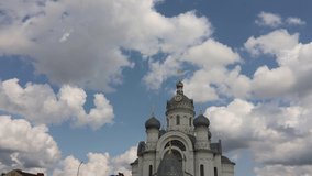 Video clip white clouds fly across the blue sky over the golden domes of the Orthodox Church