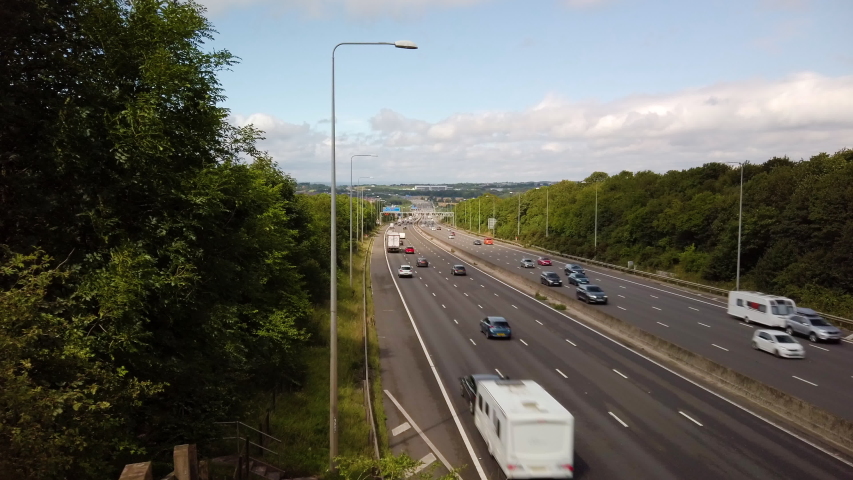 Cinematic tracking hyperlapse time lapse across Britain's M1 motorway looking Northbound towards J28 Nottinghamshire, England, UK. 4K Royalty-Free Stock Footage #1034969276