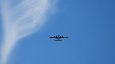 YPSILANTI, MICHIGAN / USA - August 3, 2019: A World War II era B-17 Flying Fortress gives a flyby at the 2019 Thunder Over Michigan Airshow.