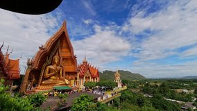 Timelaps video of Gold Buddha statue at Wat Tham Suea located in Kanchanaburi province of Thailand 