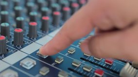 Man adjusting aound an Audio mixer, Working with sound mixing console. - Powered by Shutterstock - Get 15% off with code: PIKWIZARD15
