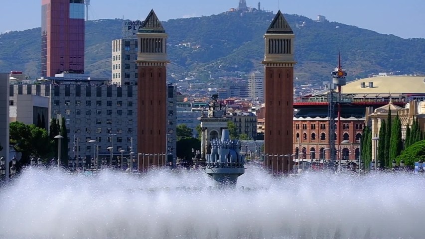 THE MAGICAL FOUNTAIN OF MONTJUIC IN BARCELONA WITH A LOT OF TOURISM AND A LOT OF HEAT IN SUMMER, HOLIDAY CONCEPT