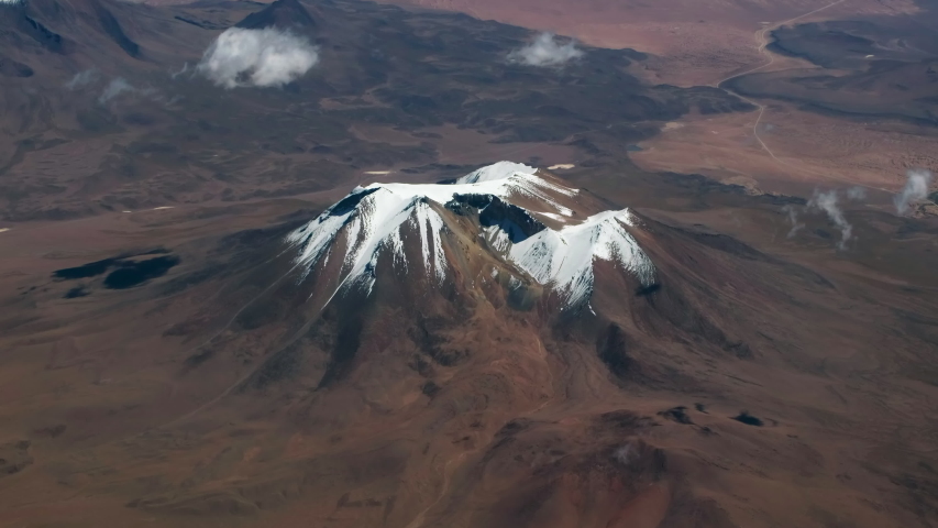 Aerial view of the snow capped mountain in Bolivian desert in Altiplano region