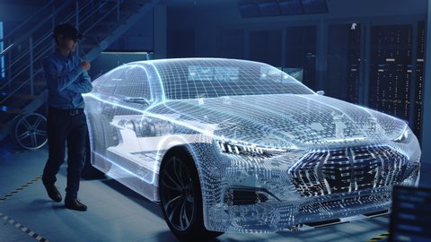 Engineer Wearing Augmented Reality Headset Chooses Body for New Electric Car Concept. 3D Graphics Visualization Shows Vehicle Frame Developing in Real Time into Futuristic Concept