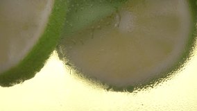 Close up of a glass of refreshing cocktail. Non-alcoholic drink with lime mint. Healthy, dietary nutrition.