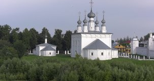 4K high quality sunny early summer morning video of Suzdal churches, buildings, hills, fields and cathedrals located on shore of Kamenka River in Vladimir Oblast in eastern Russia 220 km from Moscow