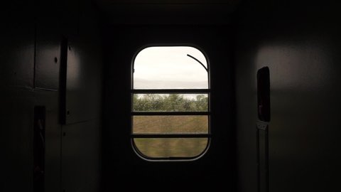 Train Window Glass. View from moving train side window Landscape Mountain Village Moody Cinematic Dramatic Shot
