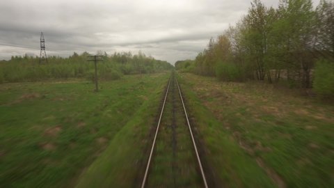 train POV railway track, rails, View from moving train window Landscape Mountain Village Moody Cinematic Dramatic Shot