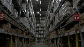 Warehouse Interior Logistics Industry Slow Motion. Walking through a huge warehouse corridor with shelves full of boxes, dolly shot - Powered by Shutterstock - Get 15% off with code: PIKWIZARD15