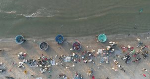 Top view. Aerial view fishing harbour market from drone. Royalty high quality free stock footage of market at Mui Ne fishing harbour or fishing village. Fishing harbor is a popular tourist destination