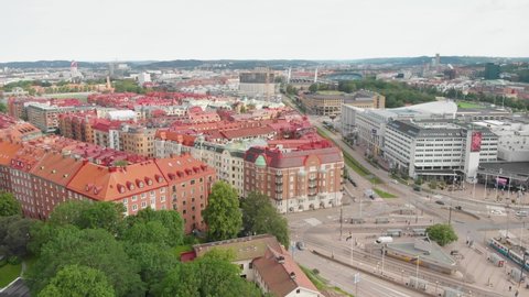 Gothenburg , Vastra Gotaland / Sweden - 06 15 2019: Aerial video of beautiful apartment buildnings near Korsvagen in the central part of Gothenburg, Sweden, with some nice green trees and bushes aroun