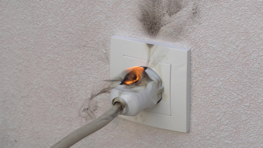Ignition of outlet during short circuit in apartment. Concept fire from electrical appliances malpractice. | Shutterstock HD Video #1035048983