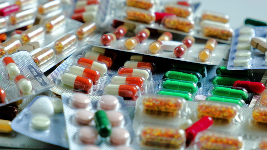 Close up with pills rotating. Pills and drugs. Medicine, pills and tablets with blister packs turning. Close-up View of Package with Medical Pills. Royalty-Free Stock Footage #1035050135