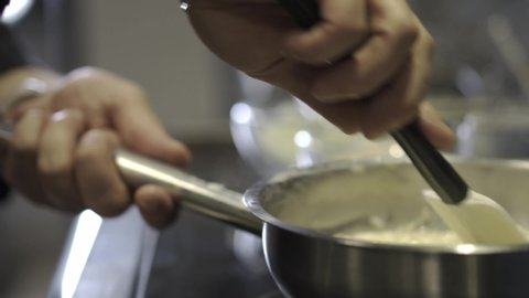 Chef Stirring Italian Rice Risotto Pot
