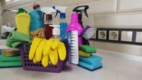 different products and items for cleaning on the floor in the kitchen. Concept cleaning. Dolly video