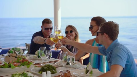 Young people enjoying food and beverages on yacht - Phuket Thailand, November 2018