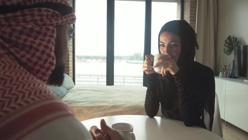 Beautiful Arab woman in traditional dress communicates with her beloved husband Royalty-Free Stock Footage #1035079436