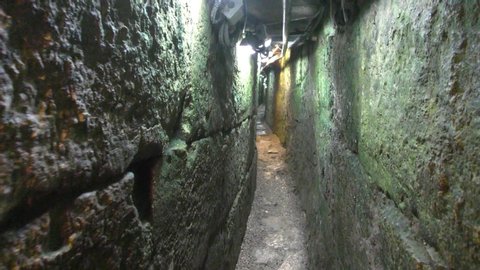 Walking in the 650m long drainage tunnel that channeled water out of the Temple Mount in City of David, Jerusalem, Israel during the great revolt of the second Temple. Not as wide as my shoulders
