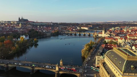 Scenic autumn aerial view of the Prague Old Town pier architecture and Charles Bridge over Vltava river in Prague, Czech Republic