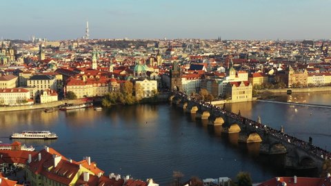 Scenic autumn aerial view of the Prague Old Town pier architecture and Charles Bridge over Vltava river in Prague, Czech Republic