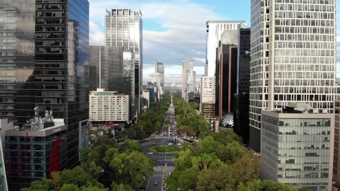 MEXICO CITY, MEXICO - JULY 2019: Aerial panoramic view of Paseo de la Reforma during sunrise with views of the skyline of the city.